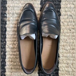 Black leather Everlane loafers.